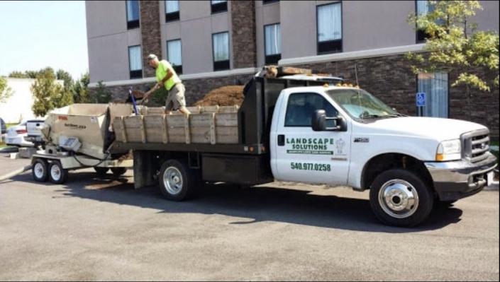 Our mulch blower allows us to spread an even layer of mulch to your flower beds.